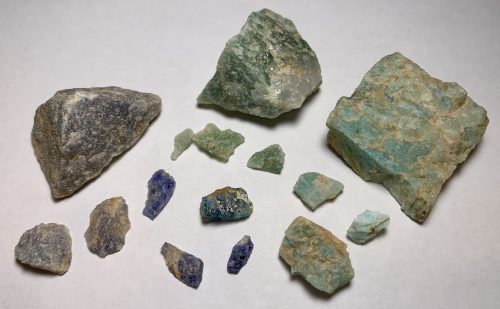 Quartz and feldspar stones arranged by color: blues and purples