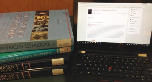 photograph of encyclopedias and reference database being used.