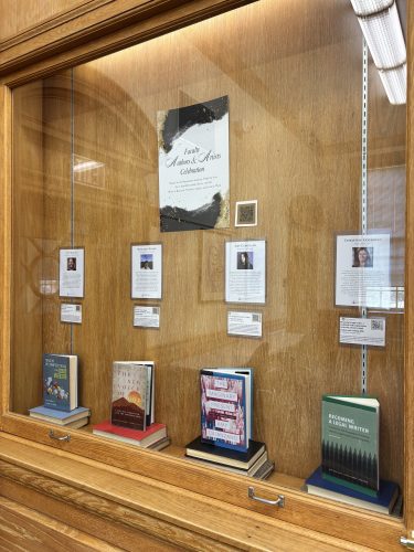 image of display cases in Ammons Gallery showing faculty books and creative works