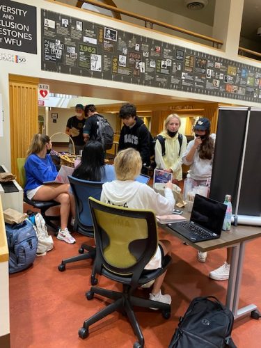 Students gather across from the library services desk during Study Sunday at ZSR