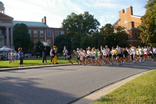 Photograph of WTL 5K runners taking off as starting pistol sounds (October 2008).