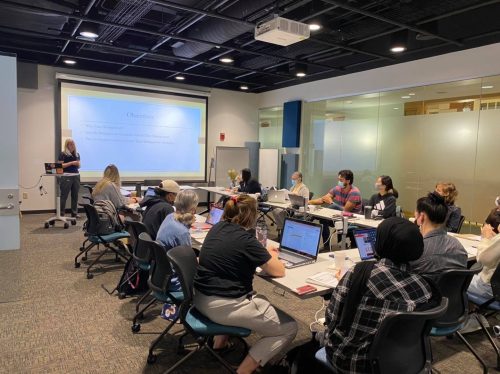 Graduate students in library classroom during research retreat