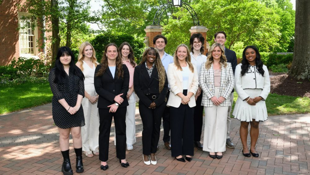 A group photo of the 2026-27 Wake Forest Fellows. Front row (from left to right): Sam Stinson, Mary Hauser, Alaina Wheeler, Lulu Clark, Sydney Calabrese, and Amaya Williams | Back row (from left to right): Fina Dooley, Hannah Reynolds, Alfredo Diaz, Jane Alexander, and Carter Dow