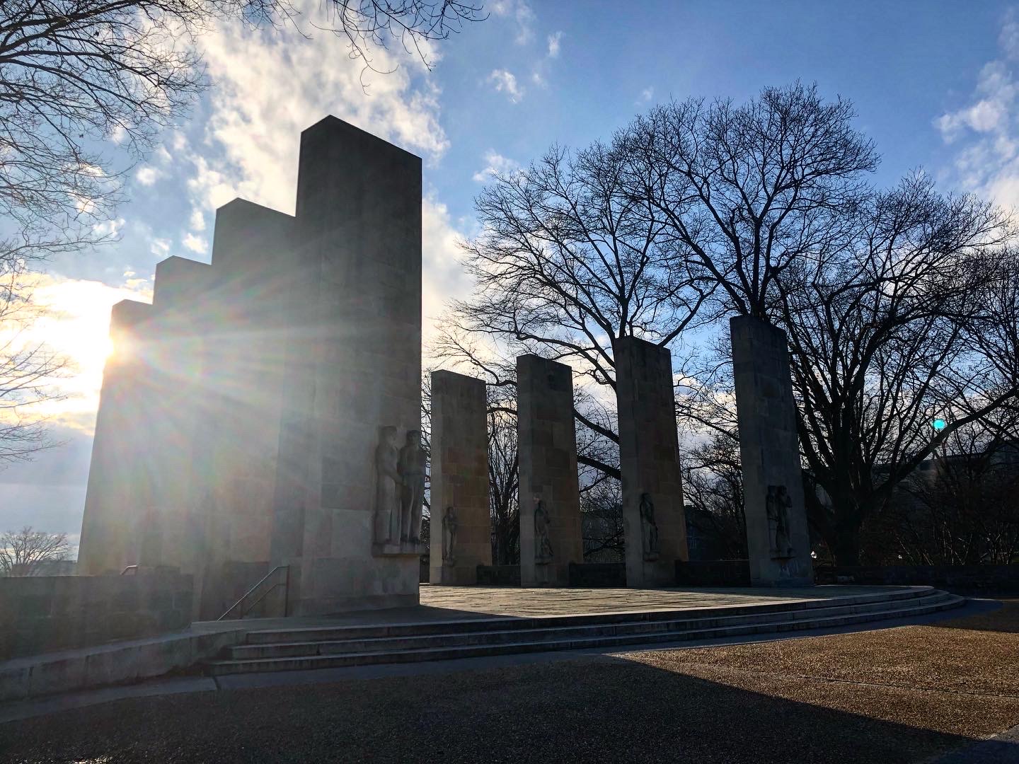 eight concrete pylons with statues 