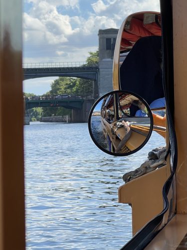 reflection of duck boat in side mirror
