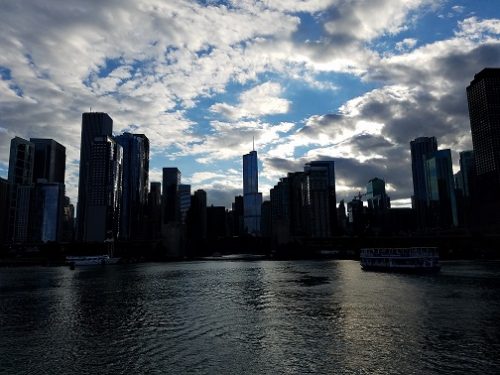 View of Chicago skyline from boat in river.