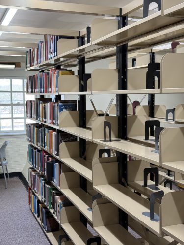 Reynolds 8 in ZSR Library with partially filled shelves; filled shelves on the left and mostly empty shelves on the right.